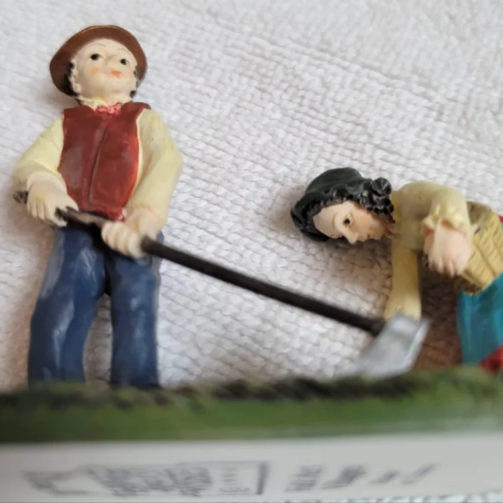 New Lang and Wise Meadowbrook Farm Man and woman planting